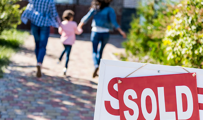 sold sign outside home